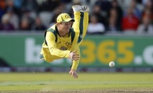 Australia's George Bailey is airborne as he throws the ball attempting a run out during the second one-day international against England at Old Trafford cricket ground in Manchester September 8, 2013. REUTERS/Philip Brown (BRITAIN - Tags: SPORT CRICKET TPX IMAGES OF THE DAY)